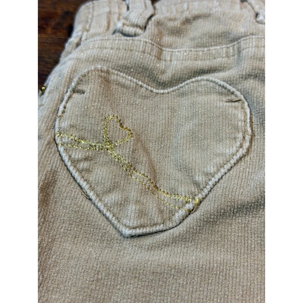 Vintage girls tan corduroy pants with glitter and heart pockets.  Sz 18 months.